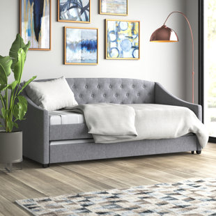 Full upholstered daybed with outlet trundle